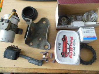 Zapalovací cívka, třmem zadní nápravy.pružiny, ložisko