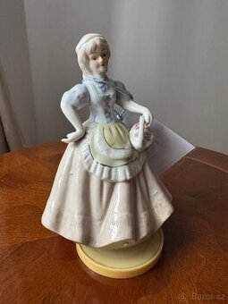 Keramická soška dámy v šatech s hracím strojkem