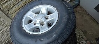 Defender ALU kola + pneu  5 ks