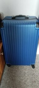 Modry skořepinovy kufr