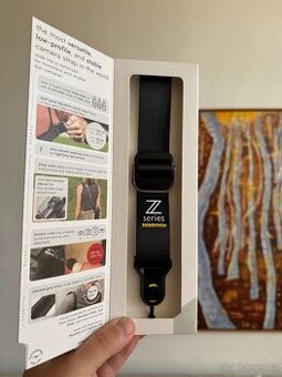 Peak Design Slide Lite s brandem Nikon