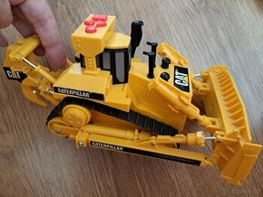 Zvukový bagr Caterpillar