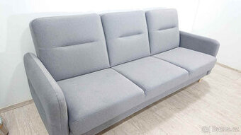 Šedá rozkládací pohovka s úložným prostorem Rhonda