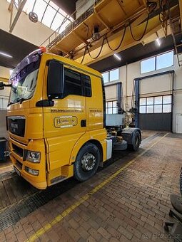 Tahač MAN TGA 18.440 4x2 + sklopná vana SCHMITZ SKI 24