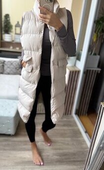 Dlouhá zimní teplá krémová vesta