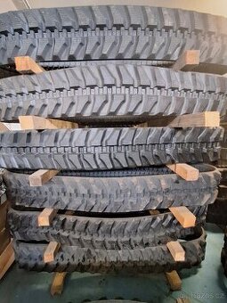 Gumové pásy pro stavební  stroje