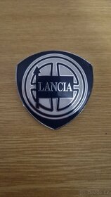 Znak do pátých dveří Lancia