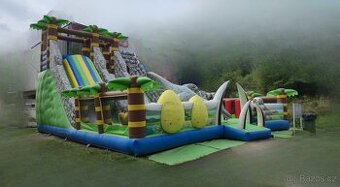 Velký dinosauří skákací hrad se skluzavkou