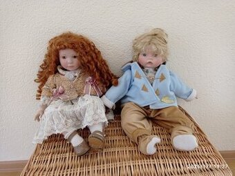 Dekorační kočárek a porcelánové panenky