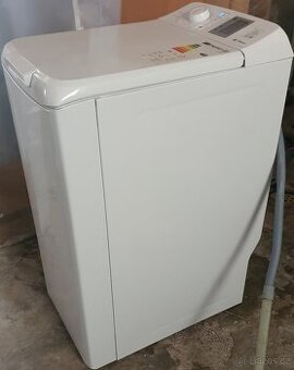 Vrchem plněná pračka Romo