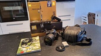 Nikon D5100 + 18-105 mm VR + taška, baterie, paměti