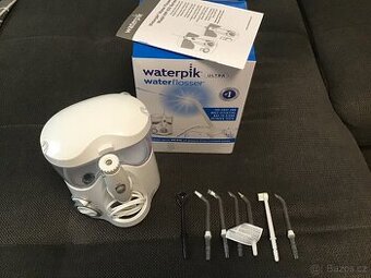 Waterpik Ultra WP100E + držák na zeď
