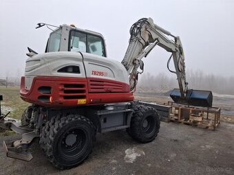Kolovy bagr Takeuchi TB295w.ne jcb.cat.komatsu