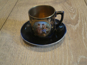 Starý hrneček s podšálkem