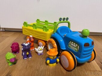 Prodam hrajici a jezdici traktor se zviratky