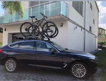 Prodám originální střešní nosič bmw + 2x držák na kola Thule