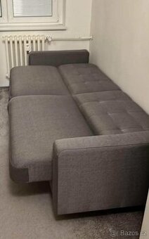 Šedivá rozkládací pohovka s úložným prostorem