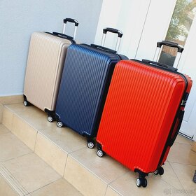 Cestovní skořepinové kufry - nové - 1