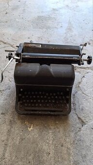 Psací stroj 500,-