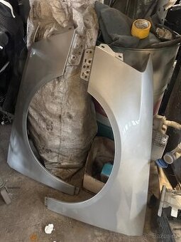 Levý blatník Passat b6