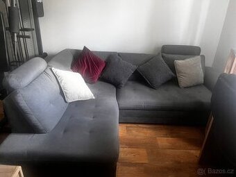 Rohová rozkládací sedačka – šedá