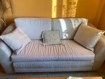 Krémový rozkládací gauč