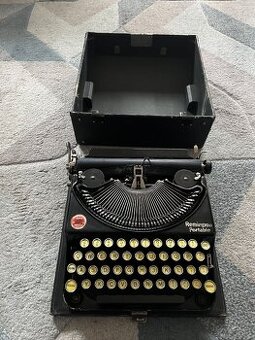 Kufříkový psací stroj Remington portable