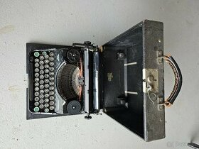 starožitný psací stroj kufříkový