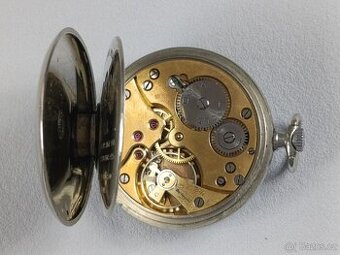 Kapesní hodinky DOXA s medailema. erotický motiv