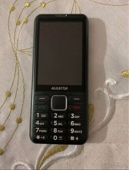 Tlačítkový telefon aligátor