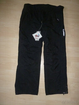 Nové pánské šusťákové kalhoty Craft vel. XL-XXL