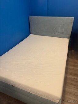 Čalouněná postel 140 cm