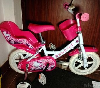 Děské kolo 12" Hello Kitty se sedačkou pro panenky a košíke