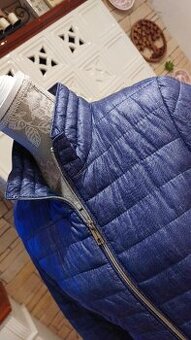 Prošívaná bunda se stojáčkem barva modrý denim-melír