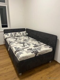 Čalouněná postel s úložným prostorem