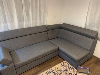 Rohový rozkládací gauč s úložným prostorem, šedý