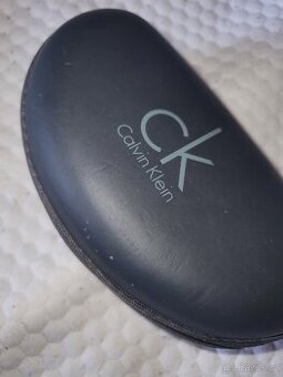 Sluneční CALVIN KLEIN S ORIGO. POUZDREM