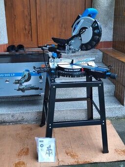 Prodám VĚTŠÍ NEPOUŽITOU pokosovou pilu s posuvem GÜDE GRK 25