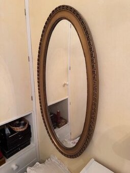 Velké nástěnné zrcadlo ve vyřezávaném zlaceném rámu