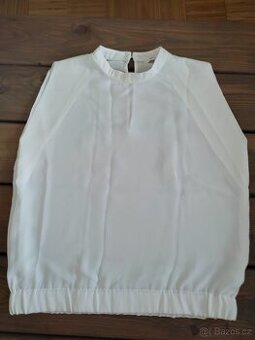 Bílá elegantní halenka bez rukávu velikost M