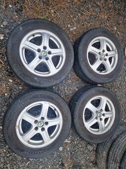 Al. disky Škoda Octavia + letní pneu. 195/65/15 Nokian