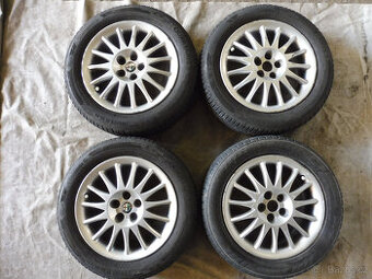 Prodám orig.16" litá kola s celo.r. pneu. na ALFA ROMEO 156