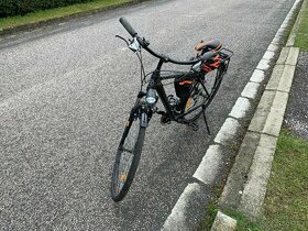 Trekingové kolo Kellys s odpruženou vidlicí SR Suntour a V-b