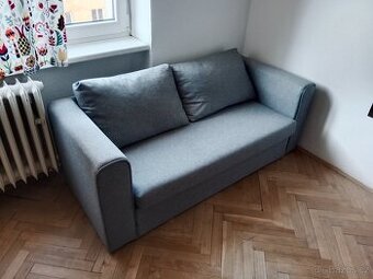 Dvoumístný šedý gauč