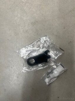 L spodní držák předního světla Škoda Rapid