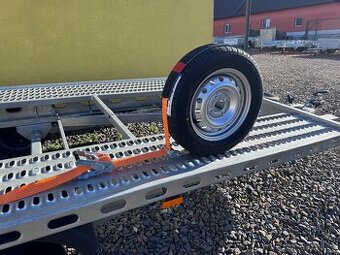 Upínací pásy na autopřepravník VDI2700