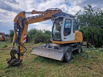 Kolové rypadlo LIEBHERR 312 kolový bagr LIEBHERR A312