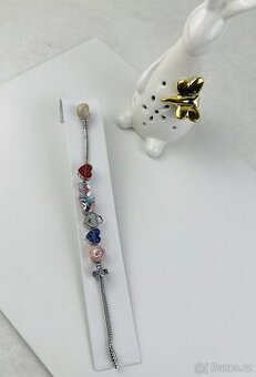 Stříbrný náramek s přívěsky 31,50g