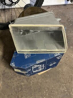 Originální nepoužitý levý reflektor Peugeot 309