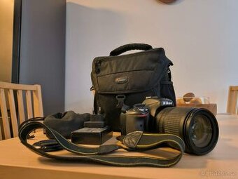 Nikon D5100 + 18 - 105 mm VR